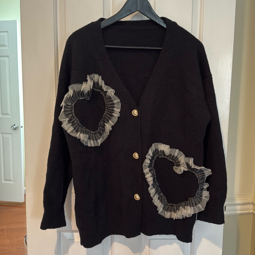 Black cardigan with hearts, no brand no tags, size is more like M